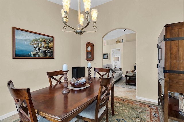 dining space featuring a chandelier and light tile patterned flooring