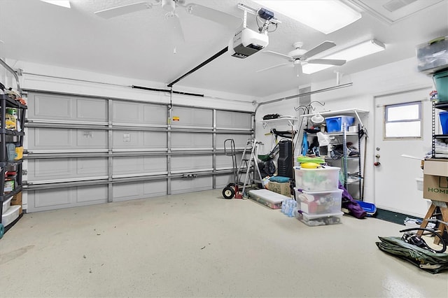 garage featuring a garage door opener and ceiling fan