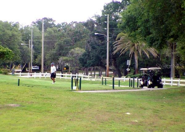 view of home's community featuring a yard