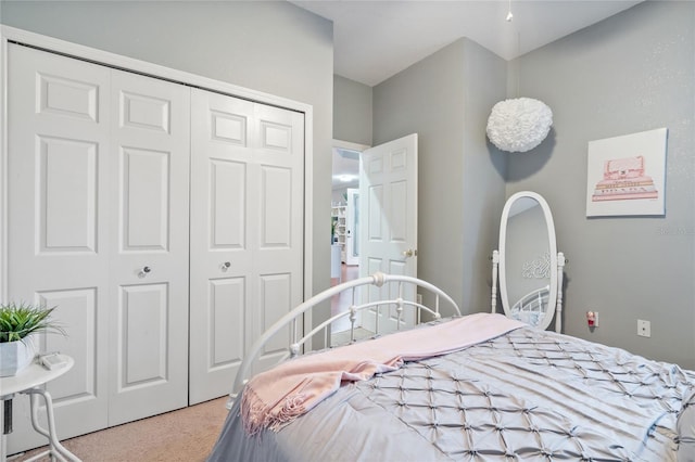 carpeted bedroom featuring a closet