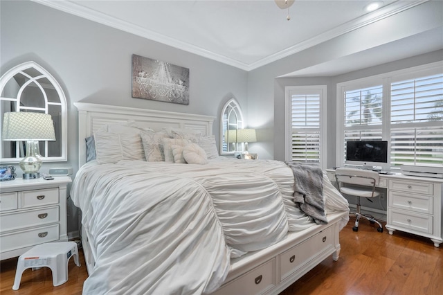 bedroom featuring crown molding and dark wood-type flooring