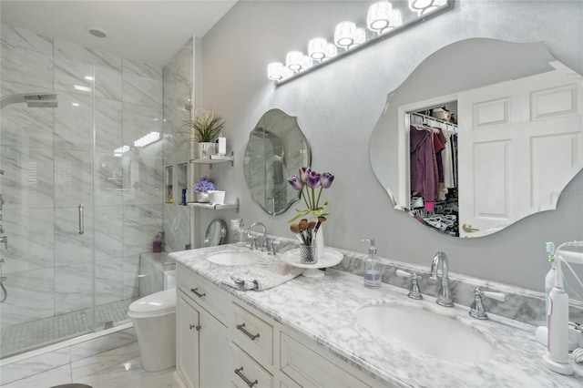 bathroom featuring toilet, vanity, and walk in shower