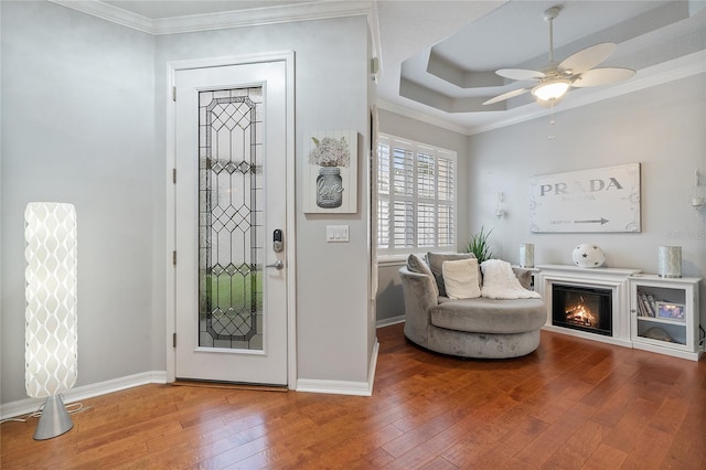 entrance foyer with crown molding, ceiling fan, and hardwood / wood-style flooring