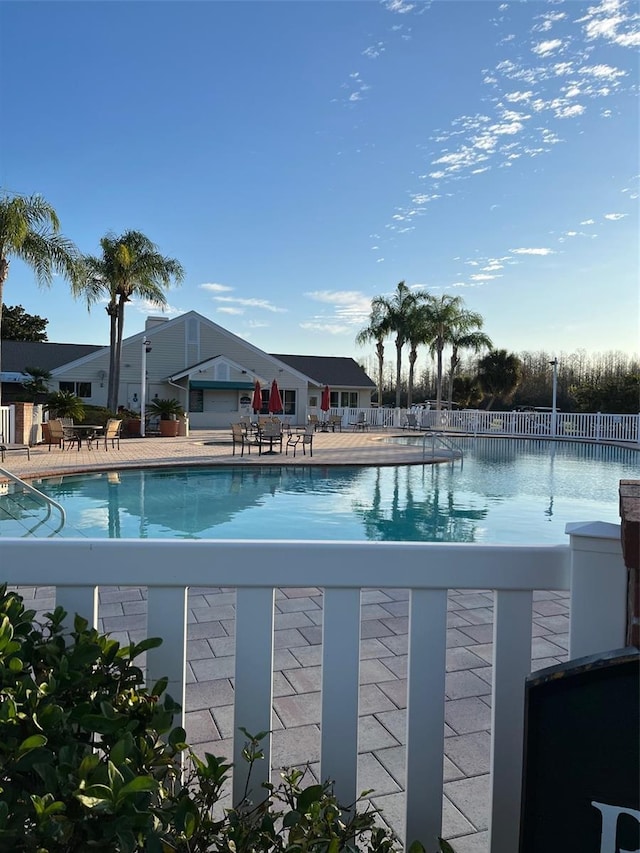 view of swimming pool featuring a patio area