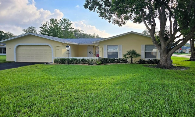 ranch-style house with a front lawn and a garage