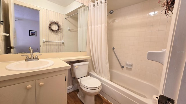 full bathroom featuring vanity, hardwood / wood-style floors, toilet, and shower / bath combo