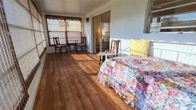 bedroom with hardwood / wood-style flooring and a closet