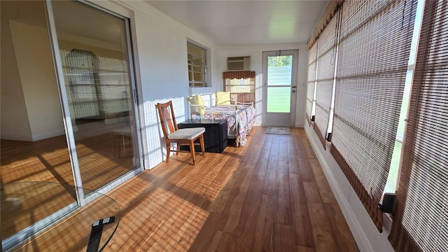 sunroom with an AC wall unit