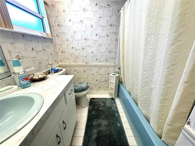 full bathroom featuring vanity, shower / tub combo, toilet, and tile patterned flooring