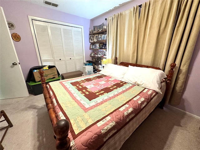 carpeted bedroom with a closet