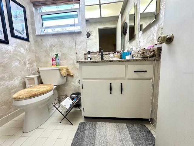 bathroom featuring vanity, toilet, and tile patterned floors