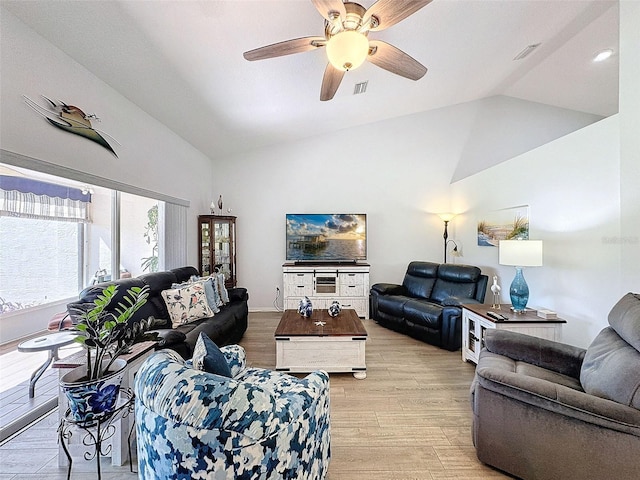 living room with high vaulted ceiling, light wood-type flooring, and ceiling fan