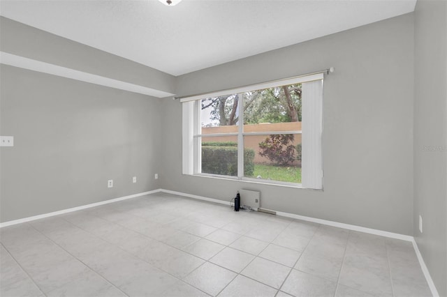 view of tiled spare room