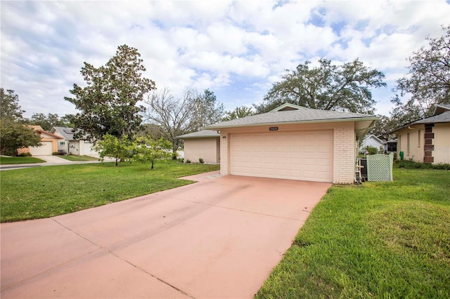 garage featuring a lawn