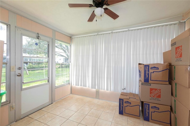 sunroom / solarium featuring ceiling fan