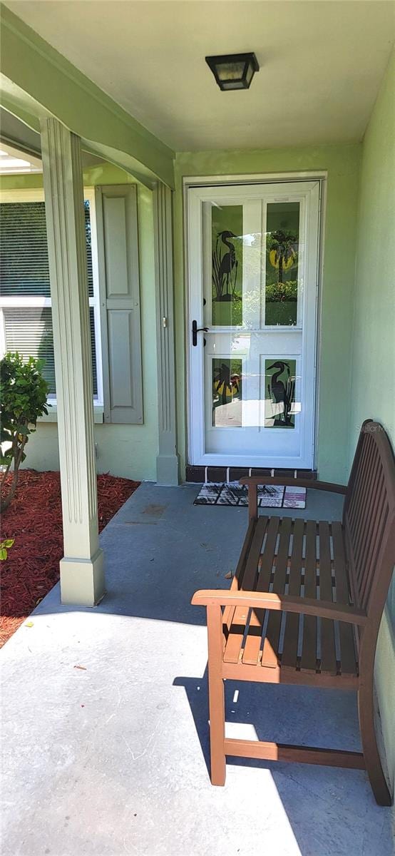 property entrance with covered porch