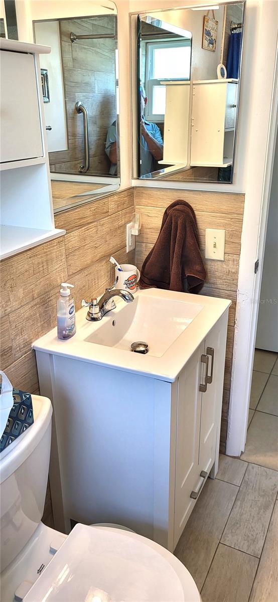 bathroom featuring vanity and toilet