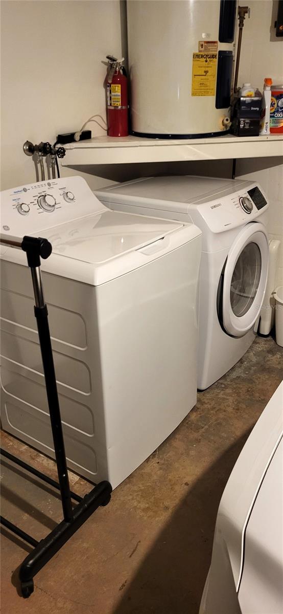 laundry room featuring washer and dryer and gas water heater