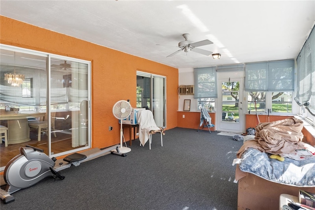 sunroom / solarium featuring ceiling fan and a wealth of natural light