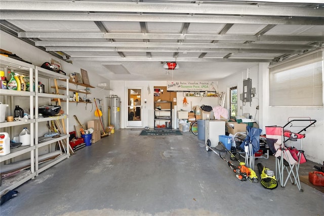 garage with a garage door opener and electric water heater