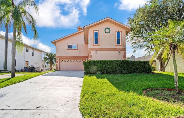 view of front of property with a front lawn and a garage