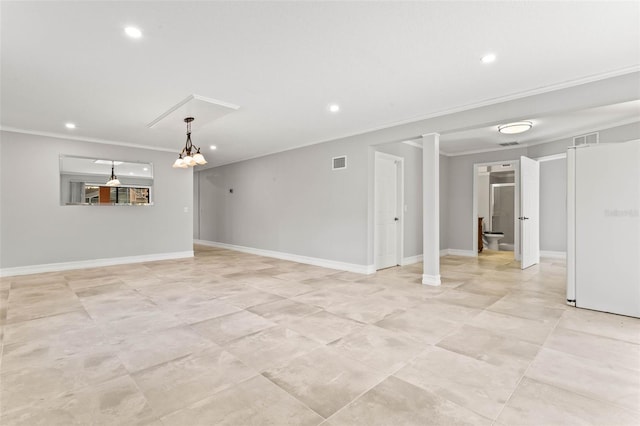 empty room with a notable chandelier and ornamental molding