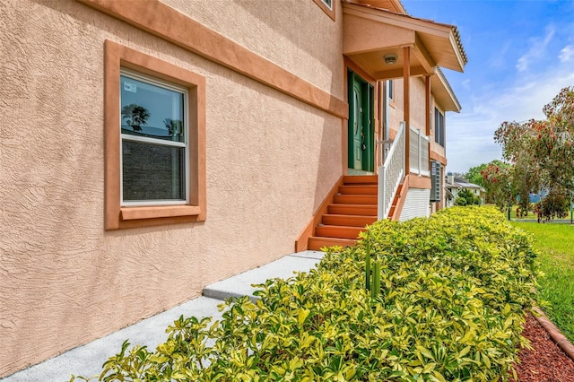 view of side of property with stucco siding