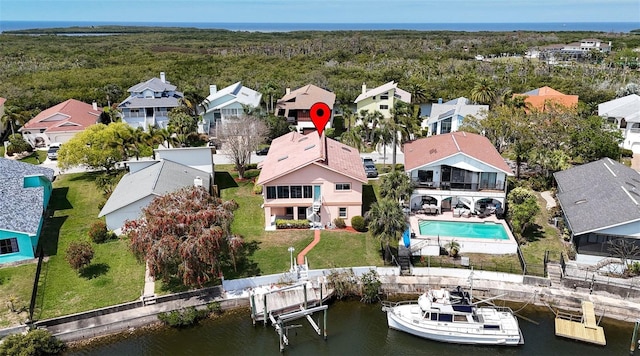 drone / aerial view with a residential view and a water view