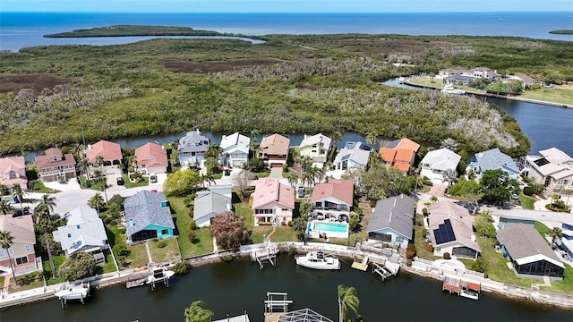 birds eye view of property featuring a residential view and a water view