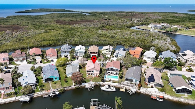 bird's eye view featuring a residential view and a water view