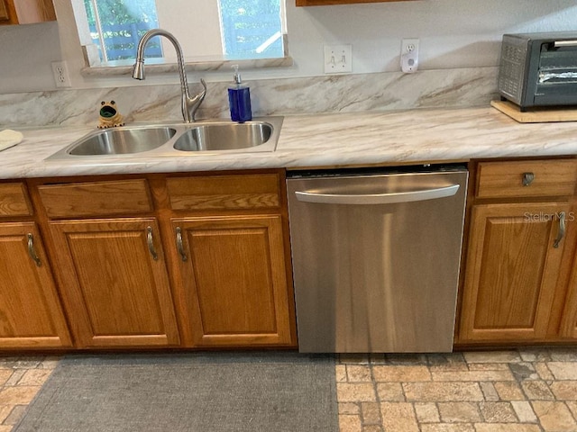 kitchen with stainless steel dishwasher and sink