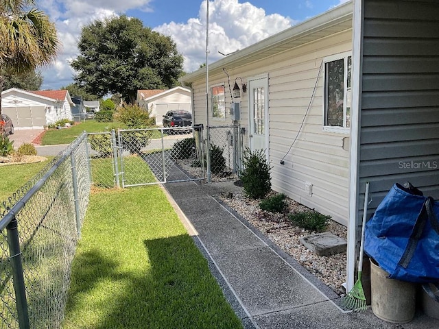 view of side of property featuring a yard