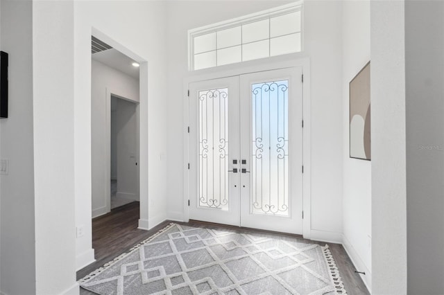 foyer entrance with hardwood / wood-style flooring