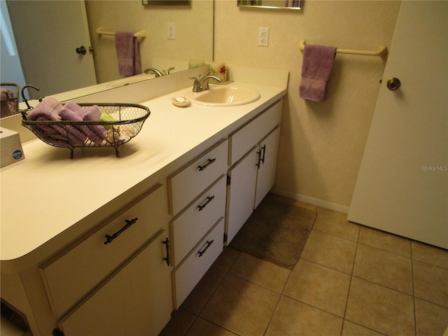 bathroom featuring vanity and tile patterned flooring