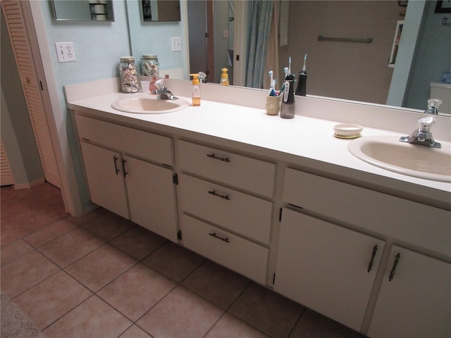 bathroom with vanity and tile patterned flooring