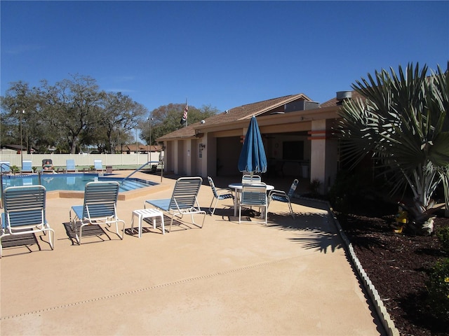 view of swimming pool with a patio