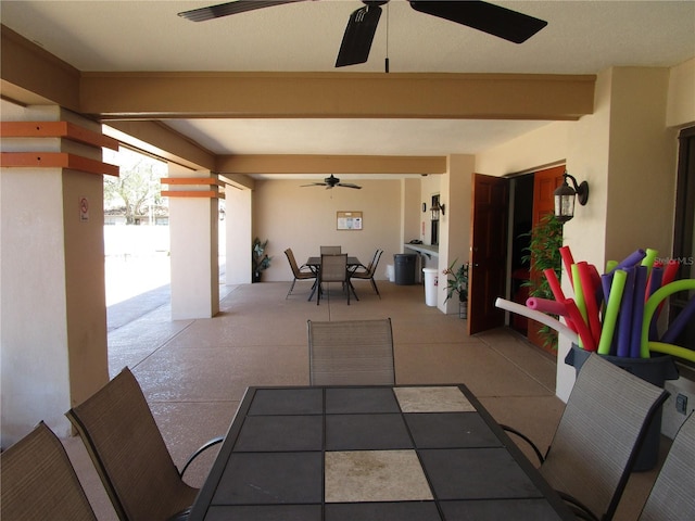 view of patio featuring ceiling fan