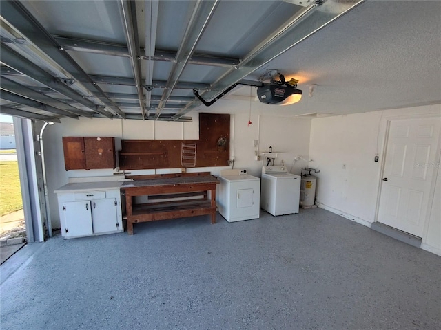 garage with washer and dryer, a garage door opener, and water heater