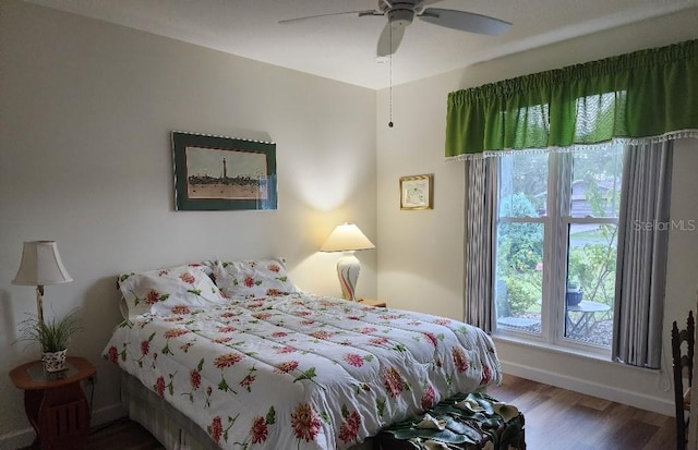 bedroom featuring hardwood / wood-style flooring and ceiling fan