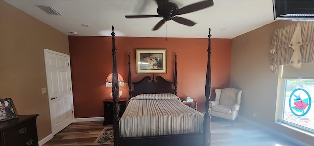 bedroom featuring ceiling fan and dark hardwood / wood-style floors