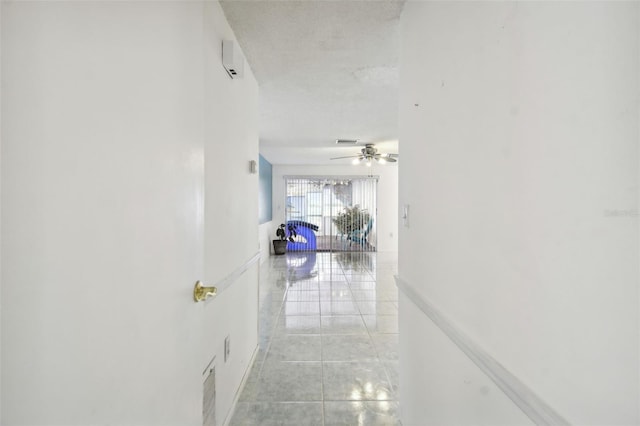 corridor featuring light tile patterned floors