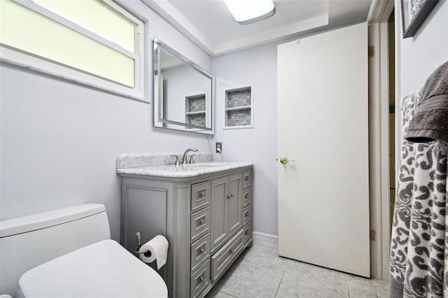 bathroom featuring vanity, toilet, and tile patterned floors