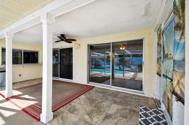 view of patio featuring ceiling fan