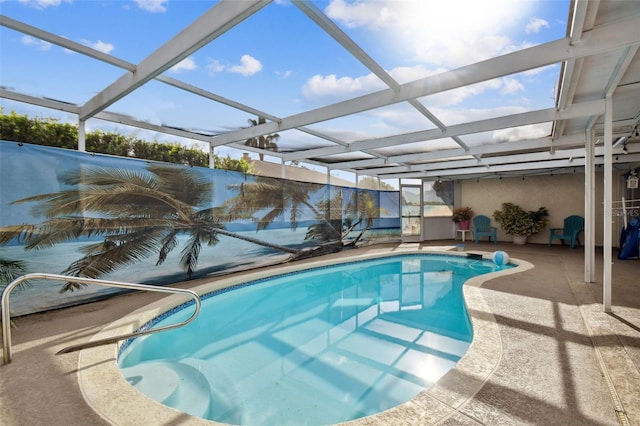 view of pool with a patio and a lanai