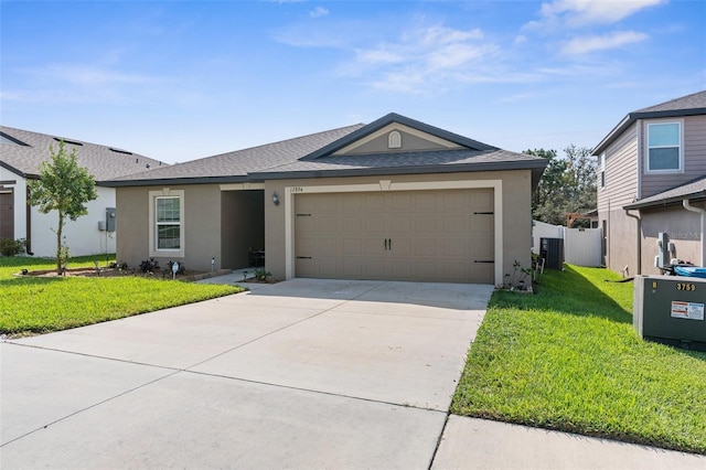 ranch-style home featuring a front yard, central AC, and a garage