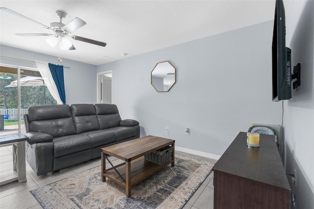 tiled living room with ceiling fan