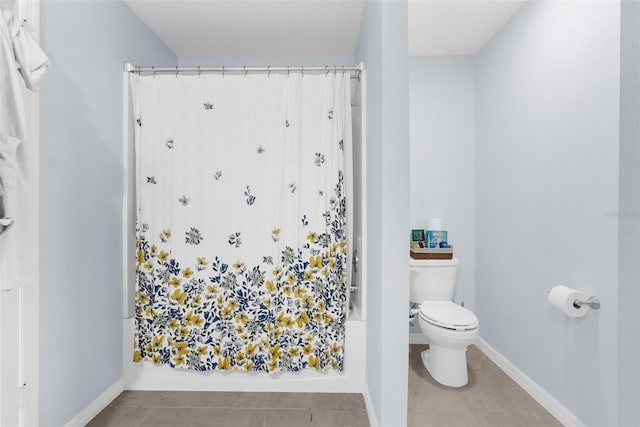 bathroom featuring tile patterned flooring and toilet