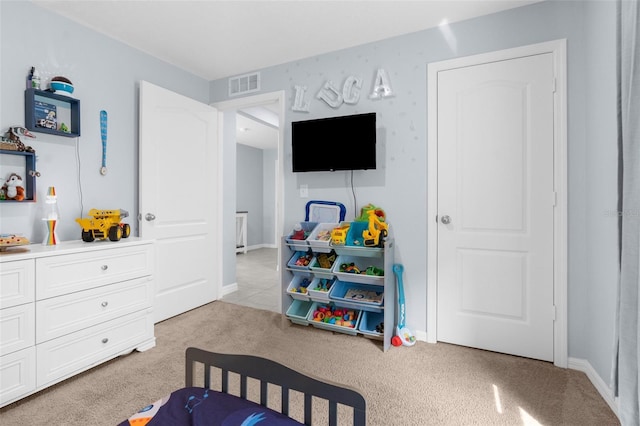 bedroom featuring light colored carpet