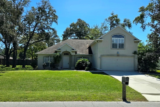 view of front of home featuring a front lawn and a garage