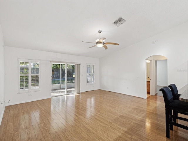 living room featuring light hardwood / wood-style flooring and ceiling fan